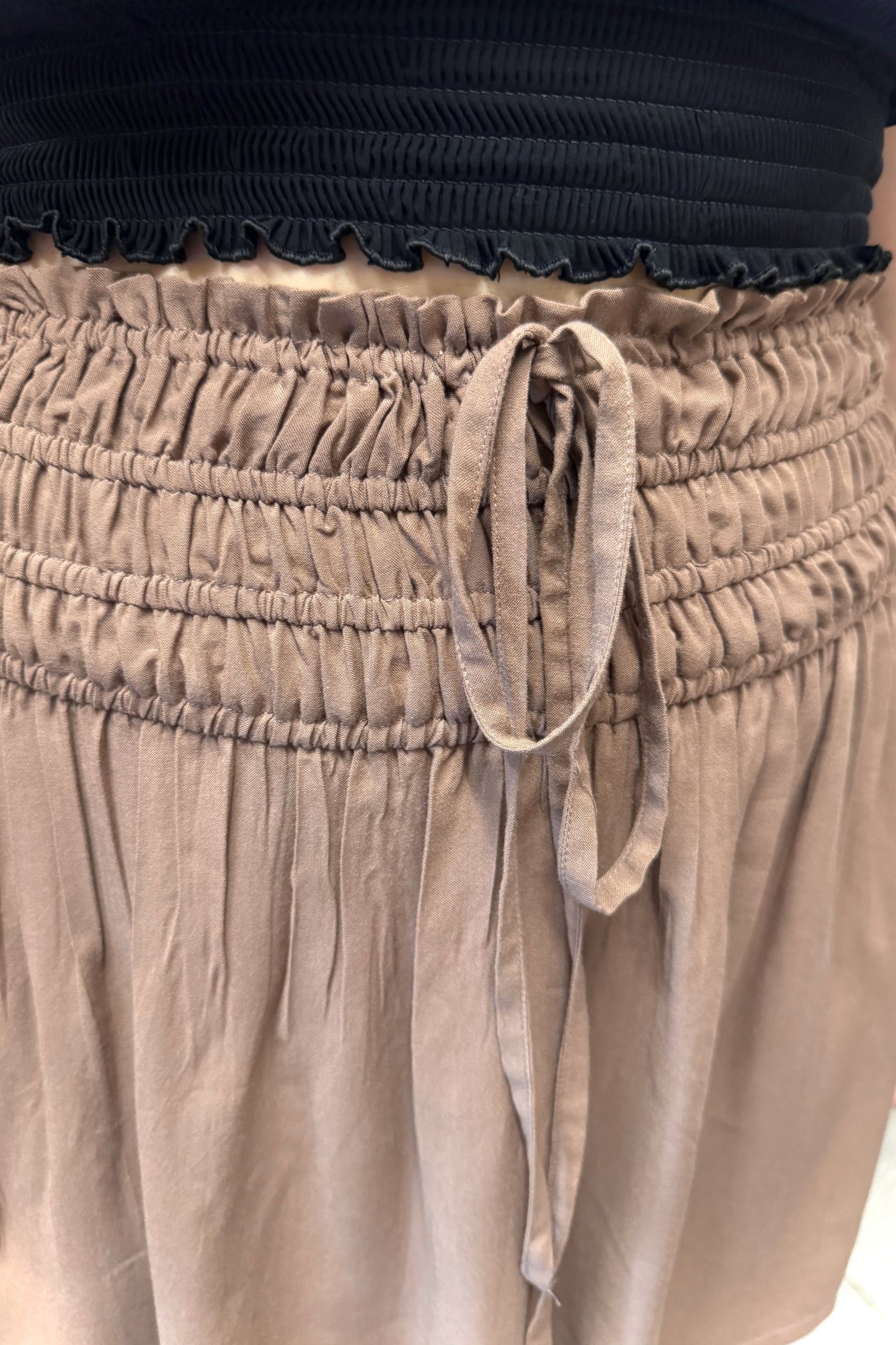 Brown mini skirt with black smocked top.