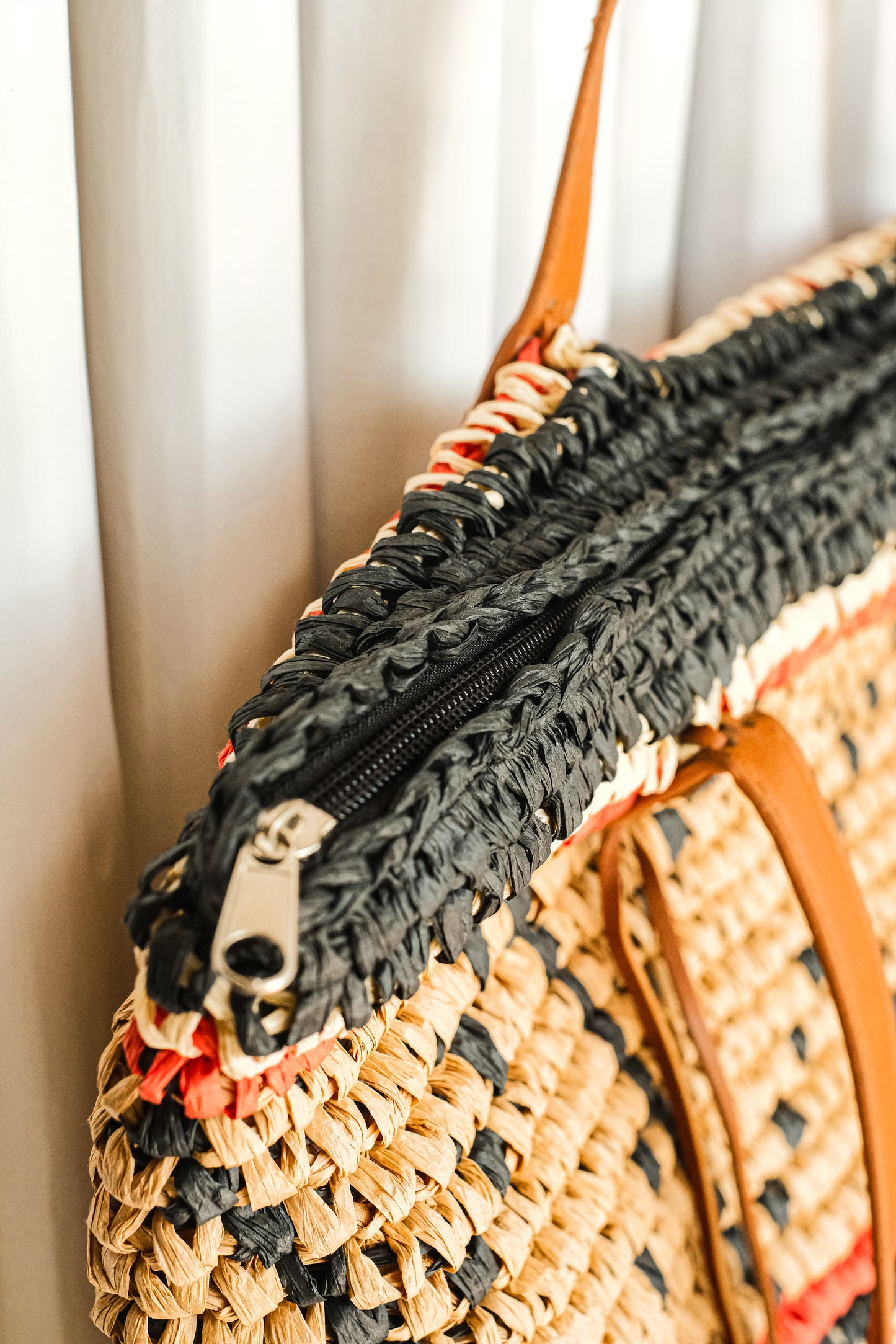 Brown, orange and black geometric pattern purse.