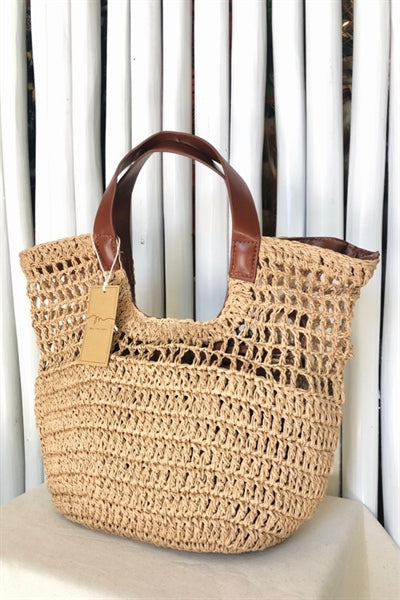 woven brown handbag with leather handle