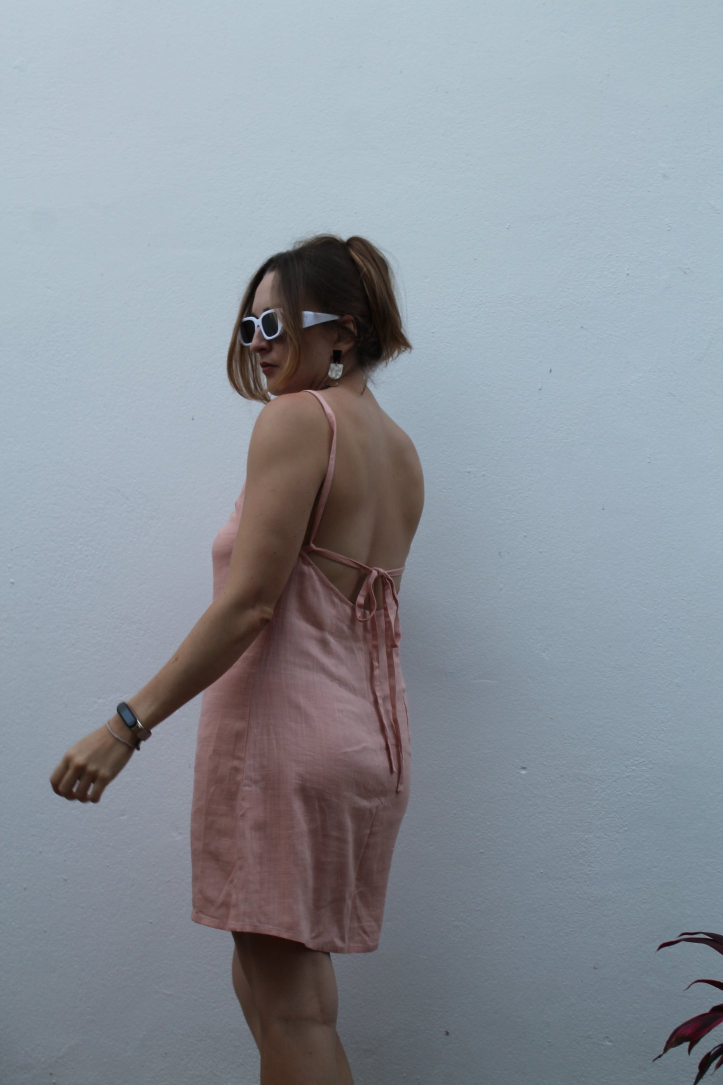 Pale pink backless linen dress.