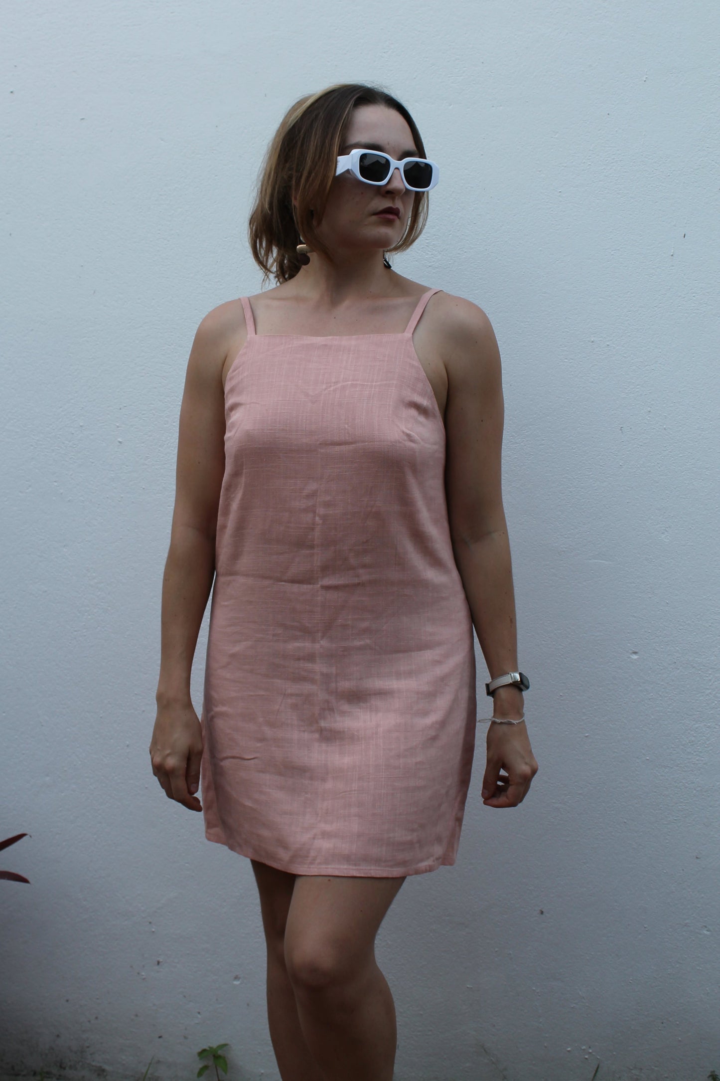 Pale pink backless linen dress.
