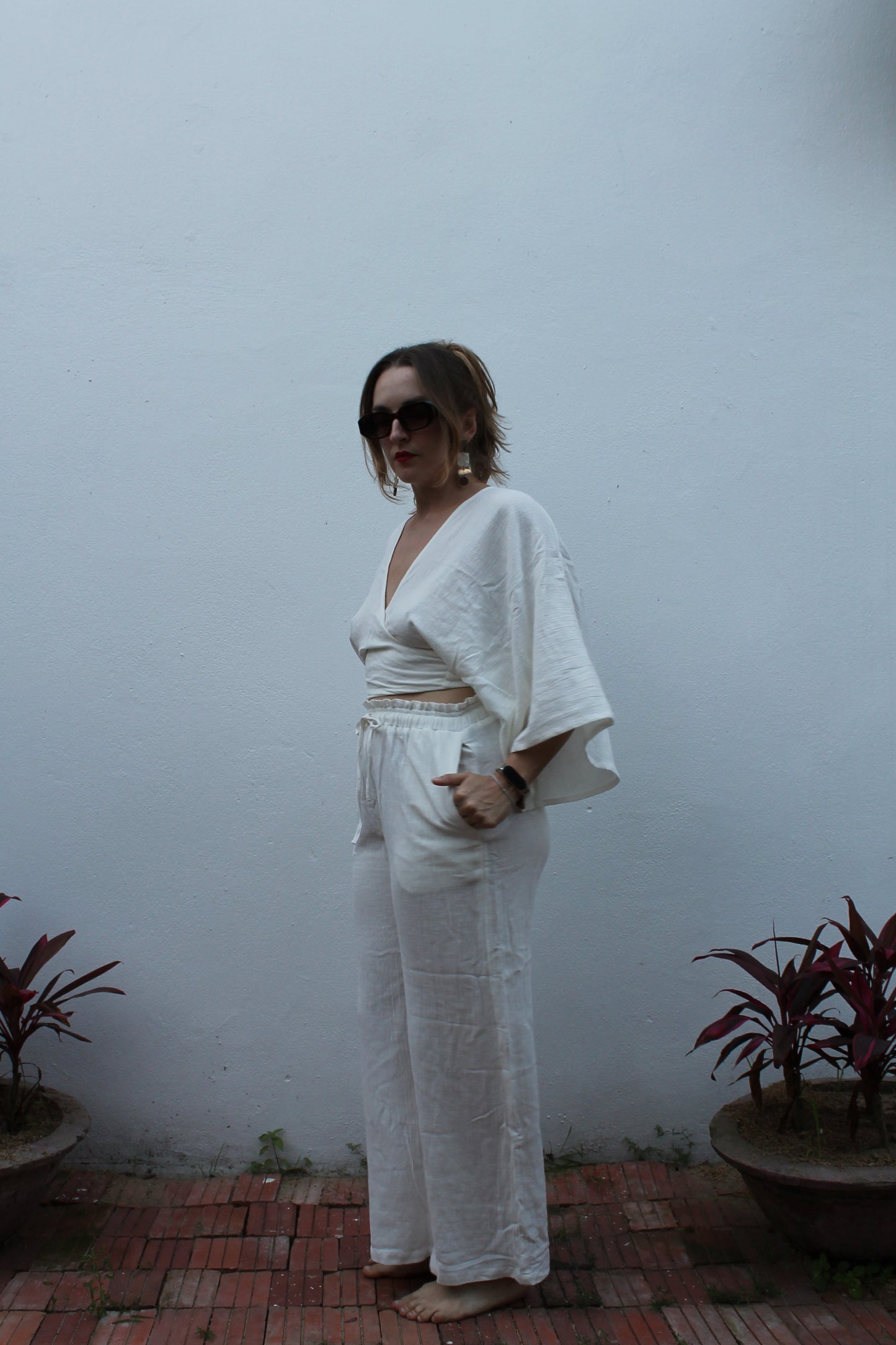 White boho style linen pants and top.