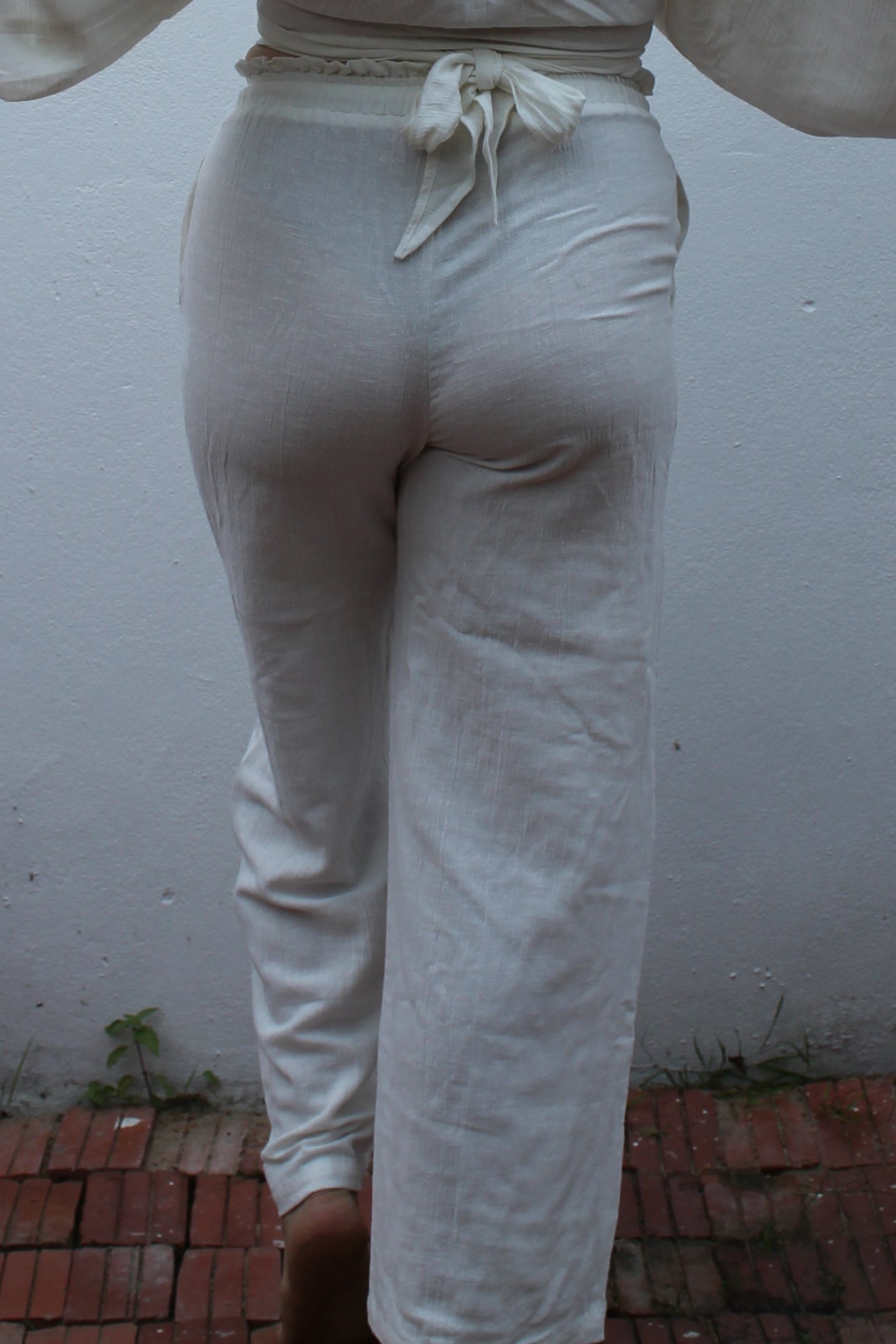 White boho style linen pants and top.