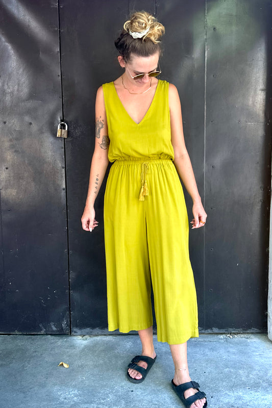 woman wearing a V-neck Sleeveless Jumpsuit with Tassel Belt
