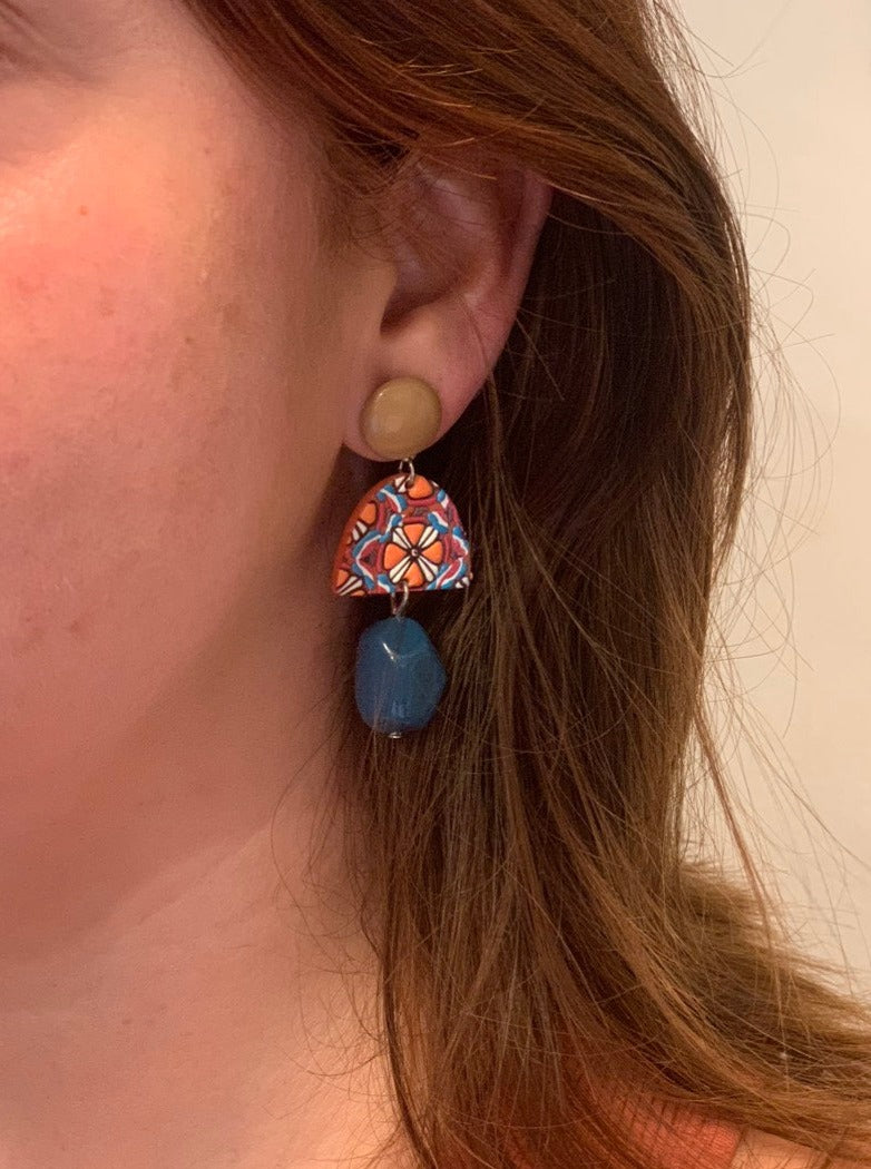 Blue and orange earrings.
