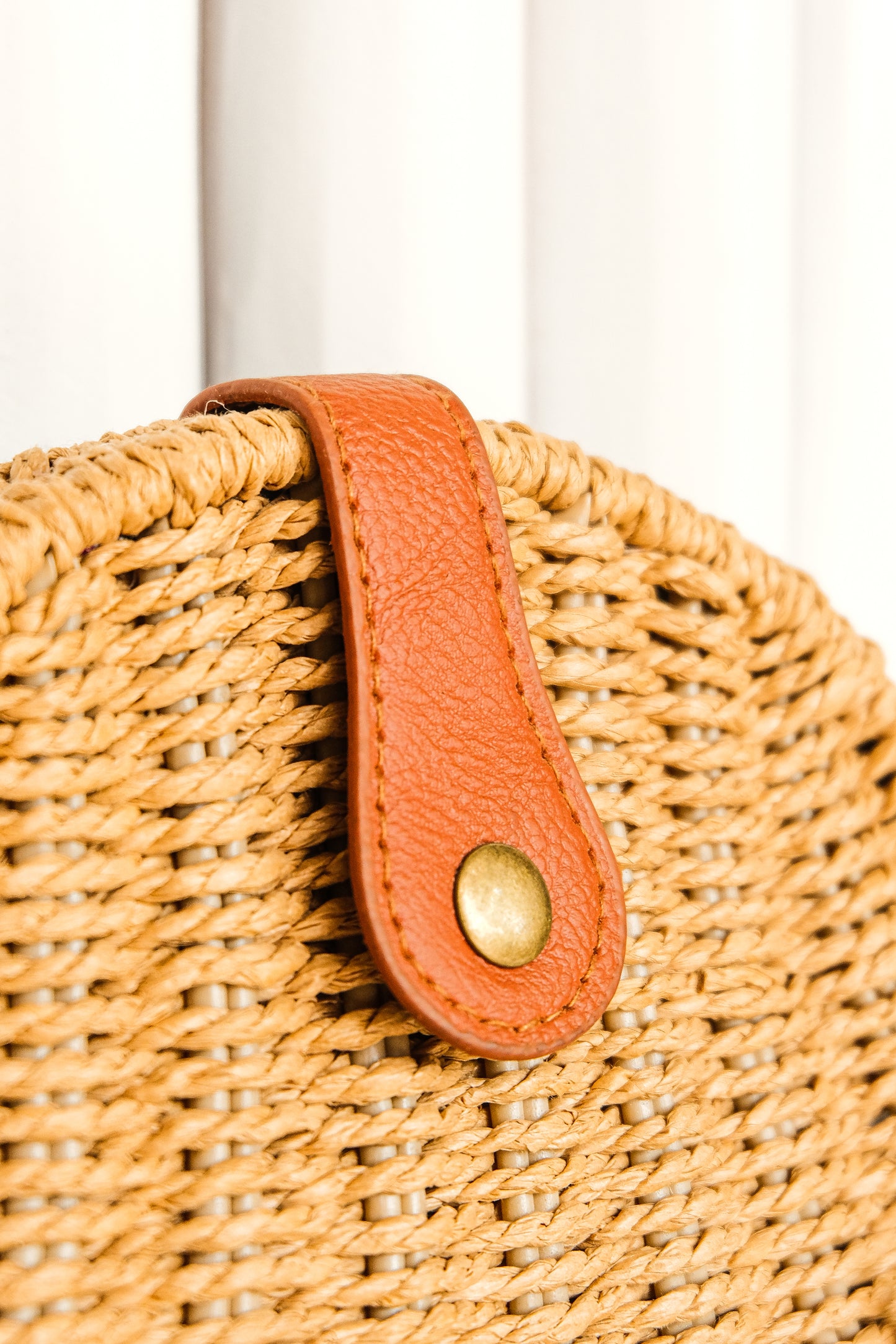 boho style brown crochet half moon bag with leather strap and clasp