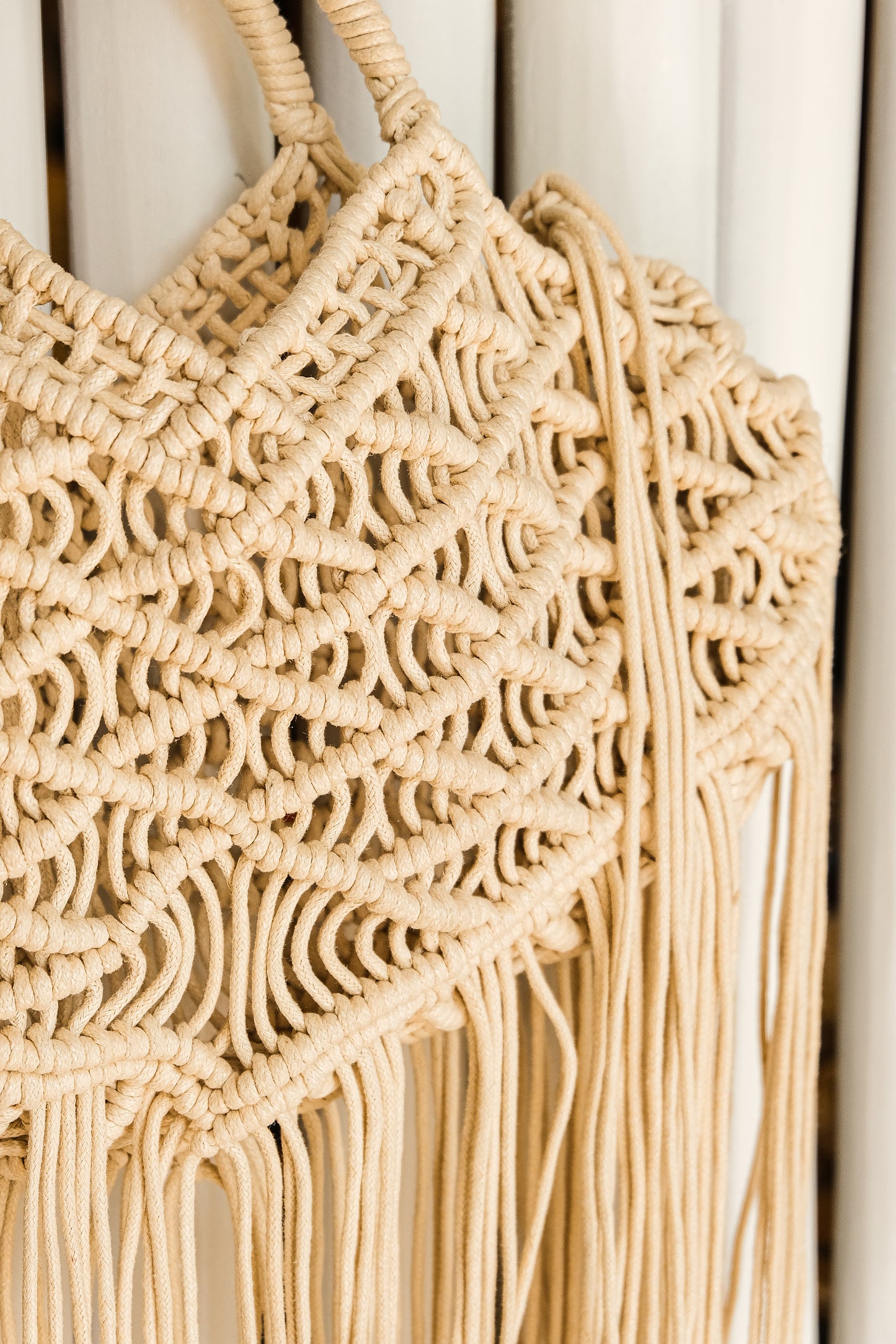 boho style cream crochet bag with tassels