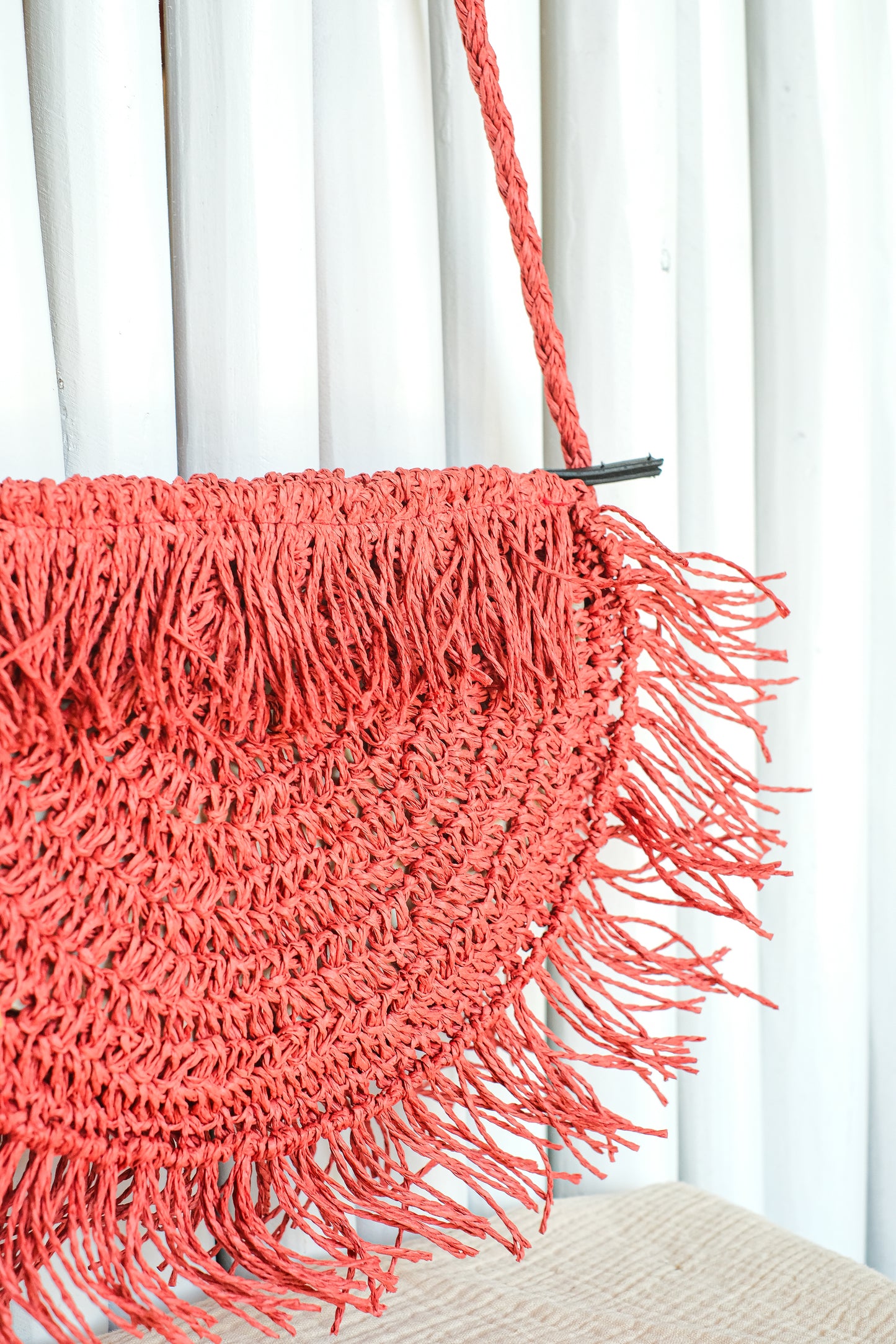 half view of boho style fringe half moon shoulder bag