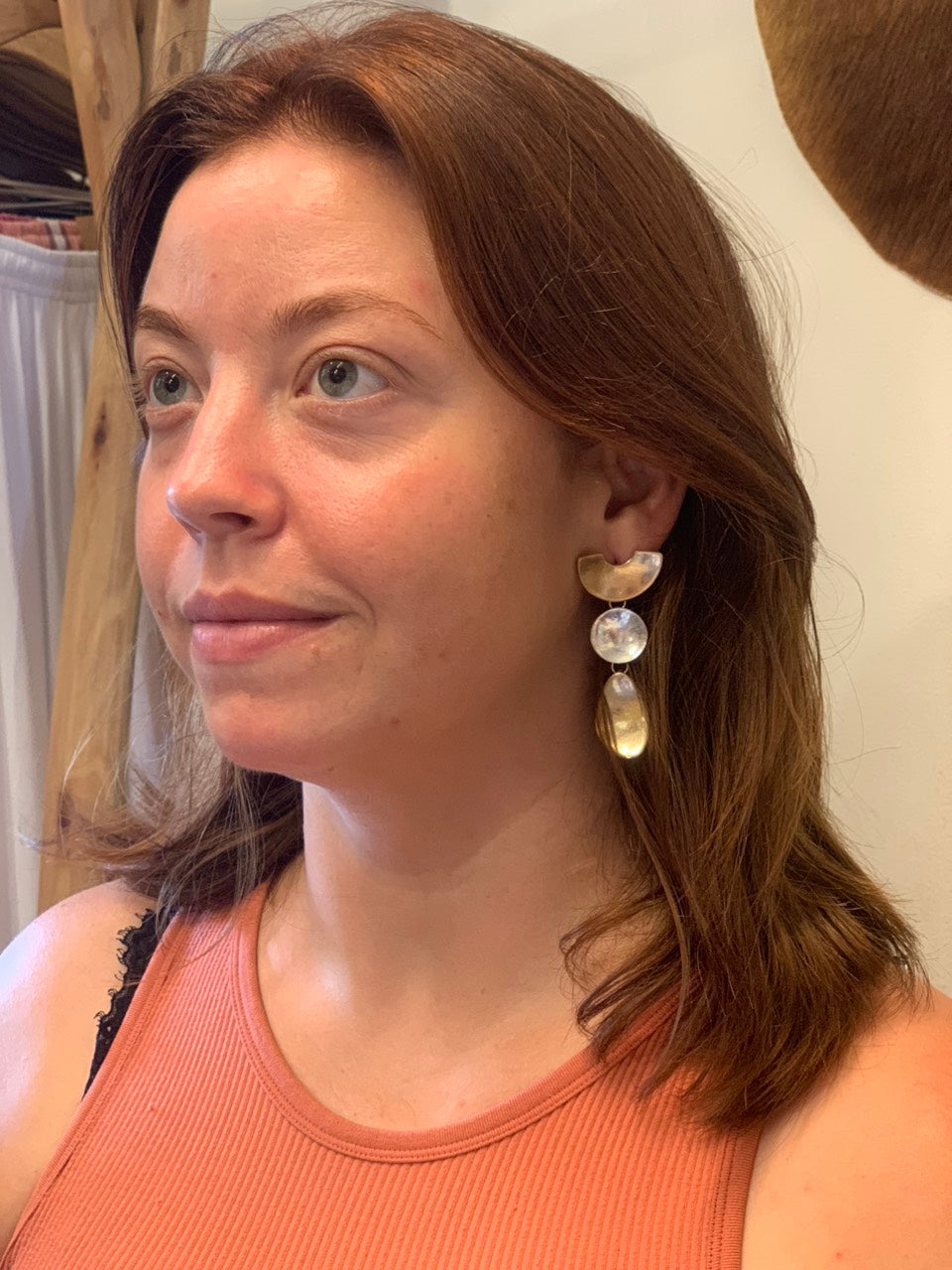 Long gold and silver earrings.