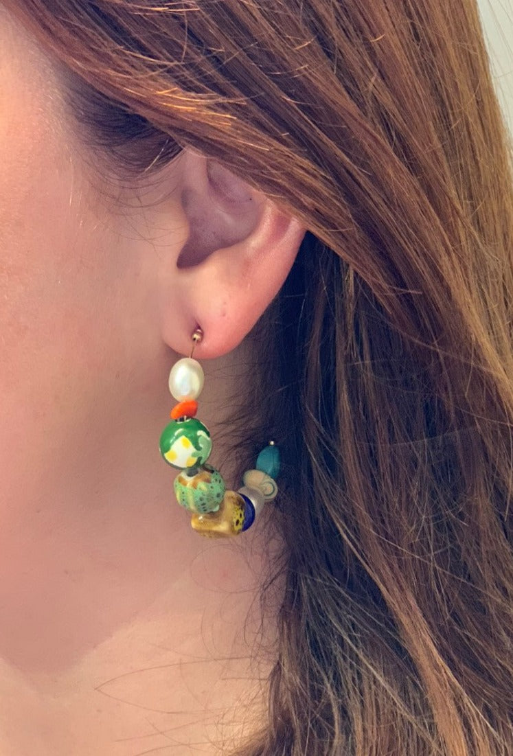Half circle earrings with multi colored beads.
