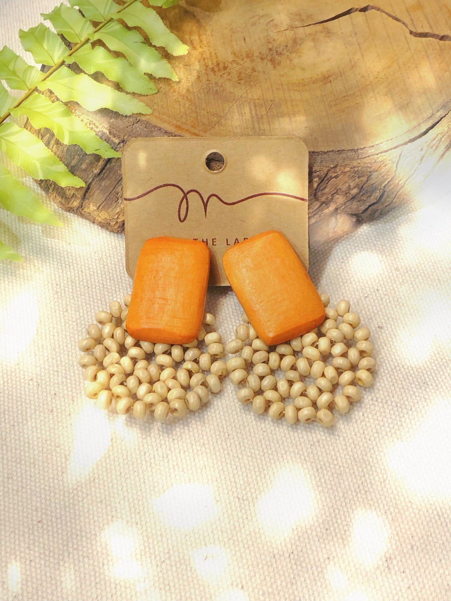 boho style orange and cream bead earrings