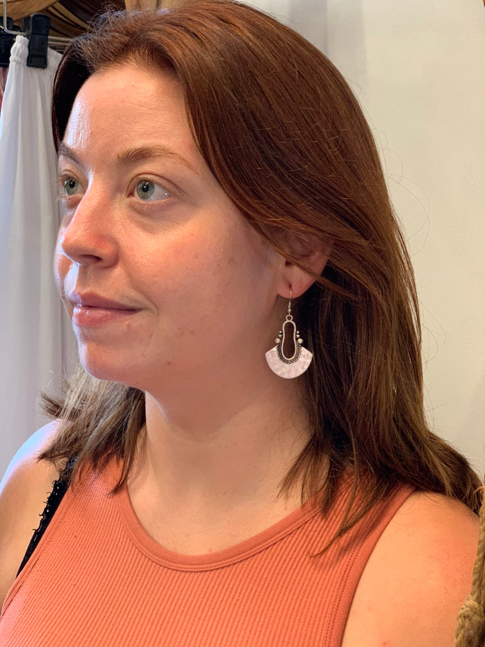 woman wearing boho style silver fanned earrings