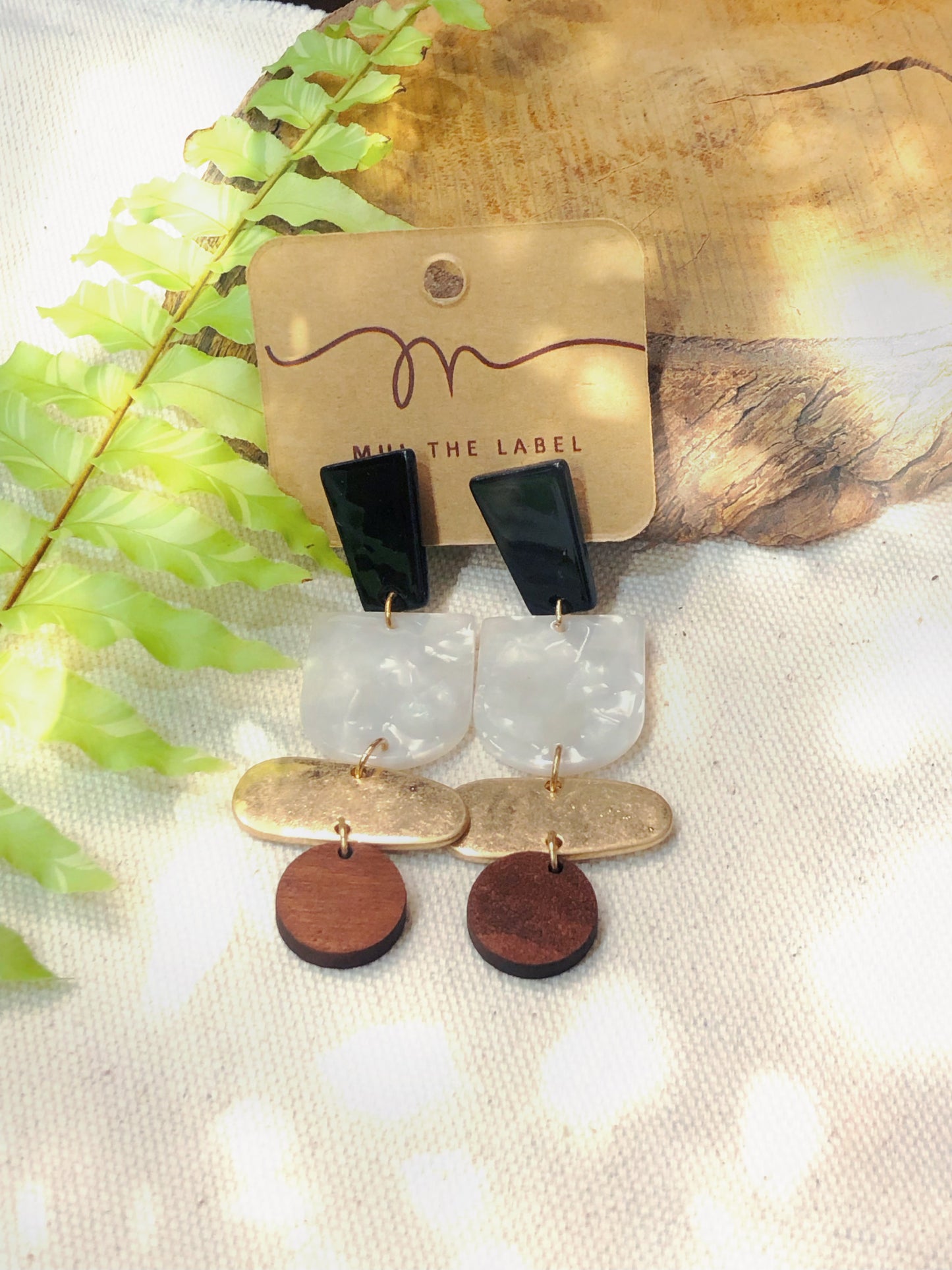 Black, cream, gold and wooden drop earrings.