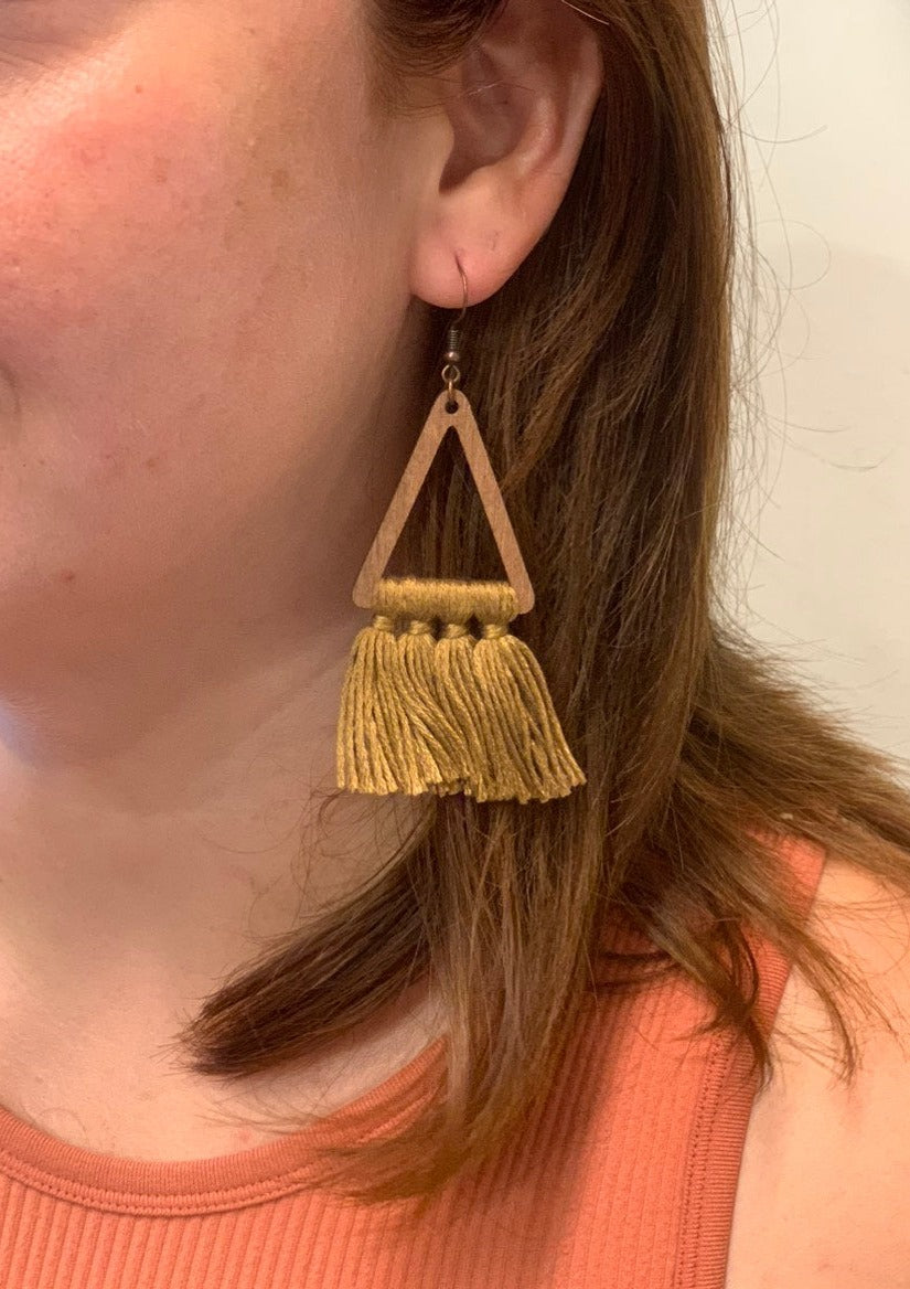 woman wearing boho style wooden triangle frill earrings
