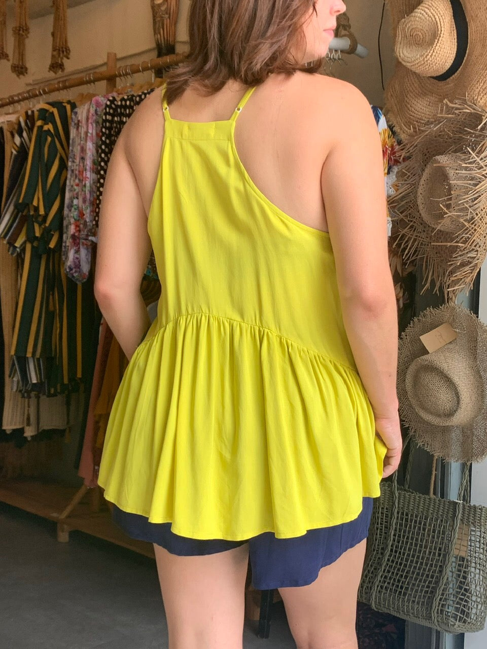 yellow top back view with short pants