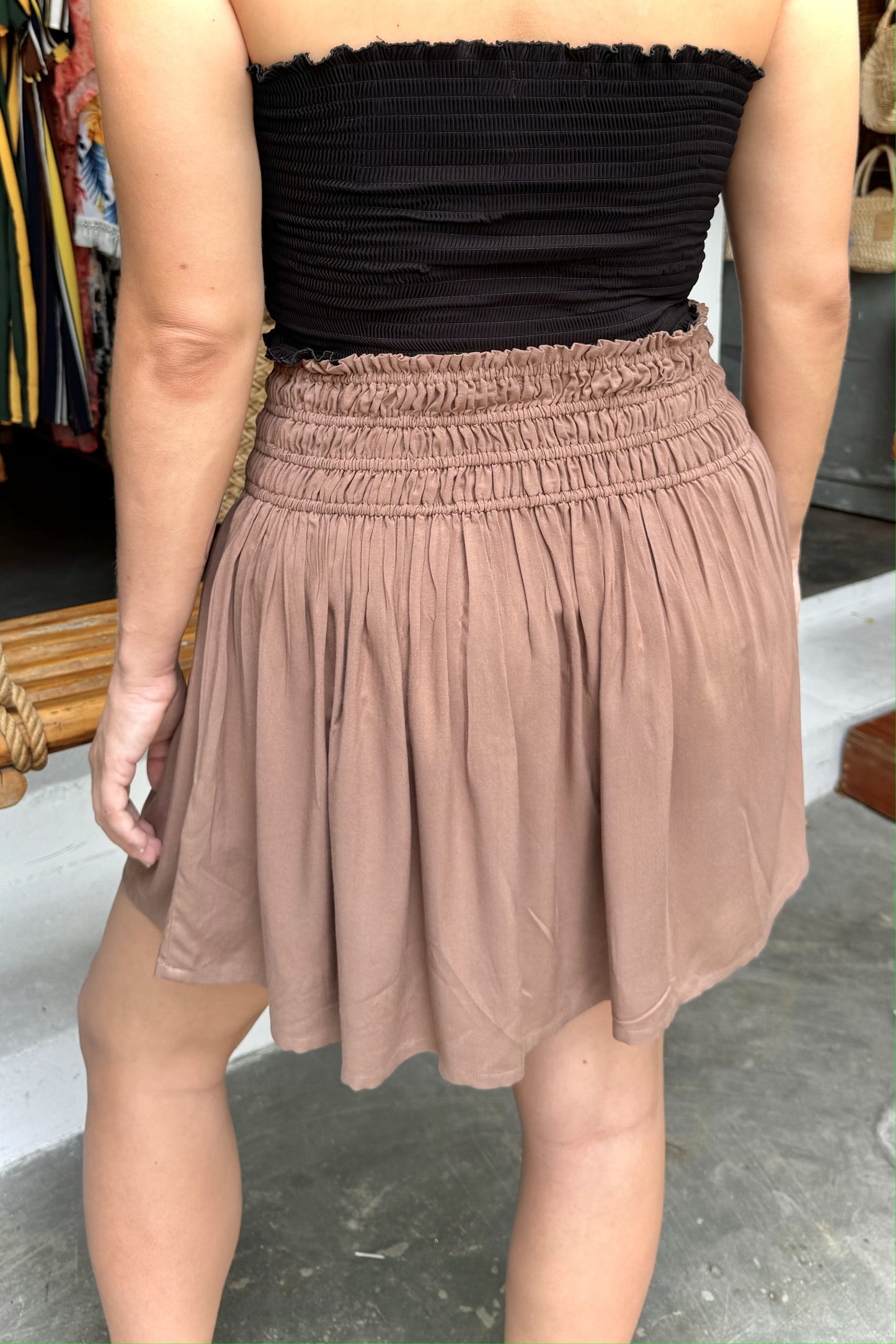 Brown mini skirt with black smocked top.