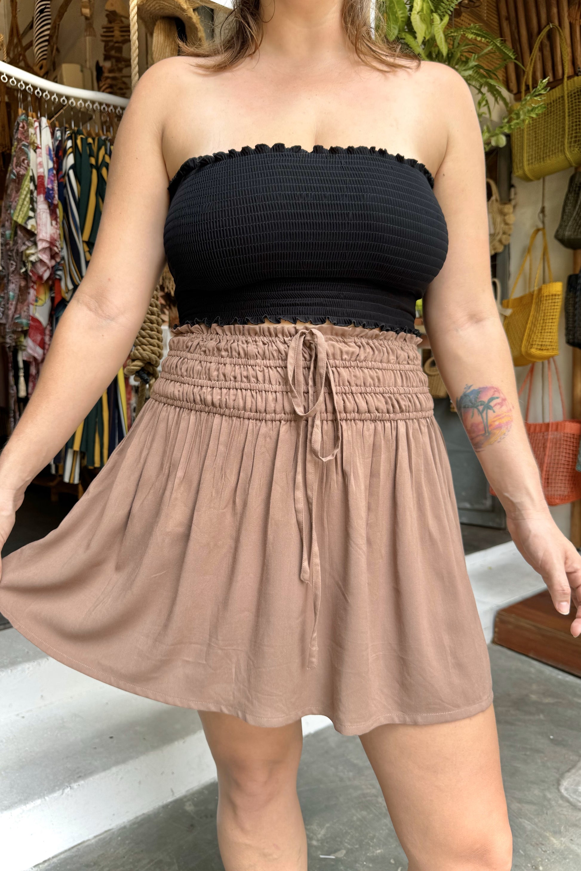 Brown mini skirt with black smocked top.