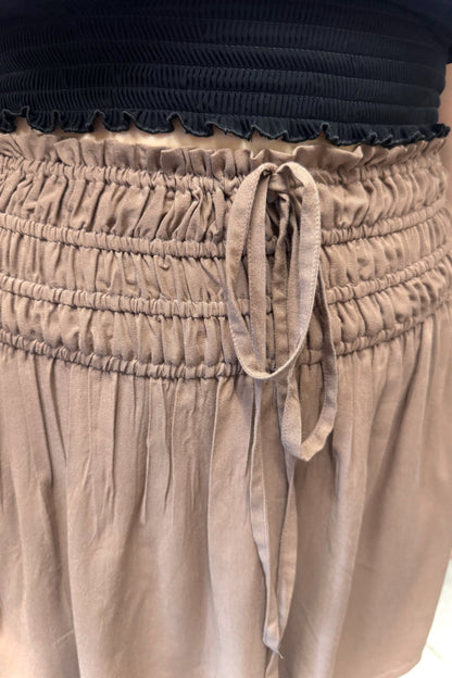 Brown mini skirt with black smocked top.