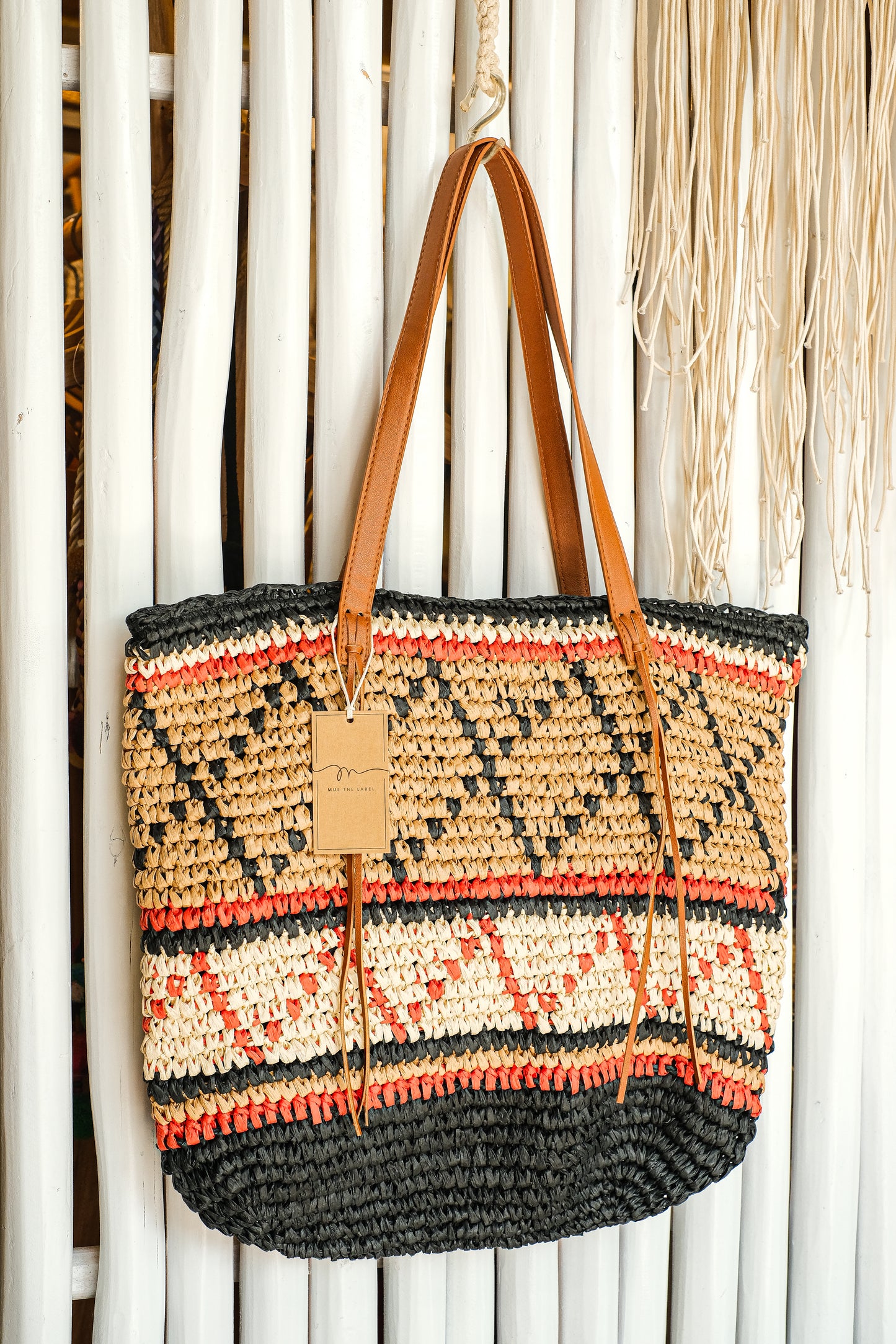 Brown, orange and black geometric pattern purse.