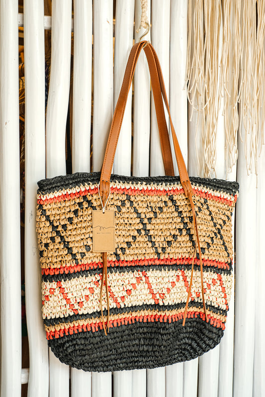 Brown, orange and black geometric pattern purse.