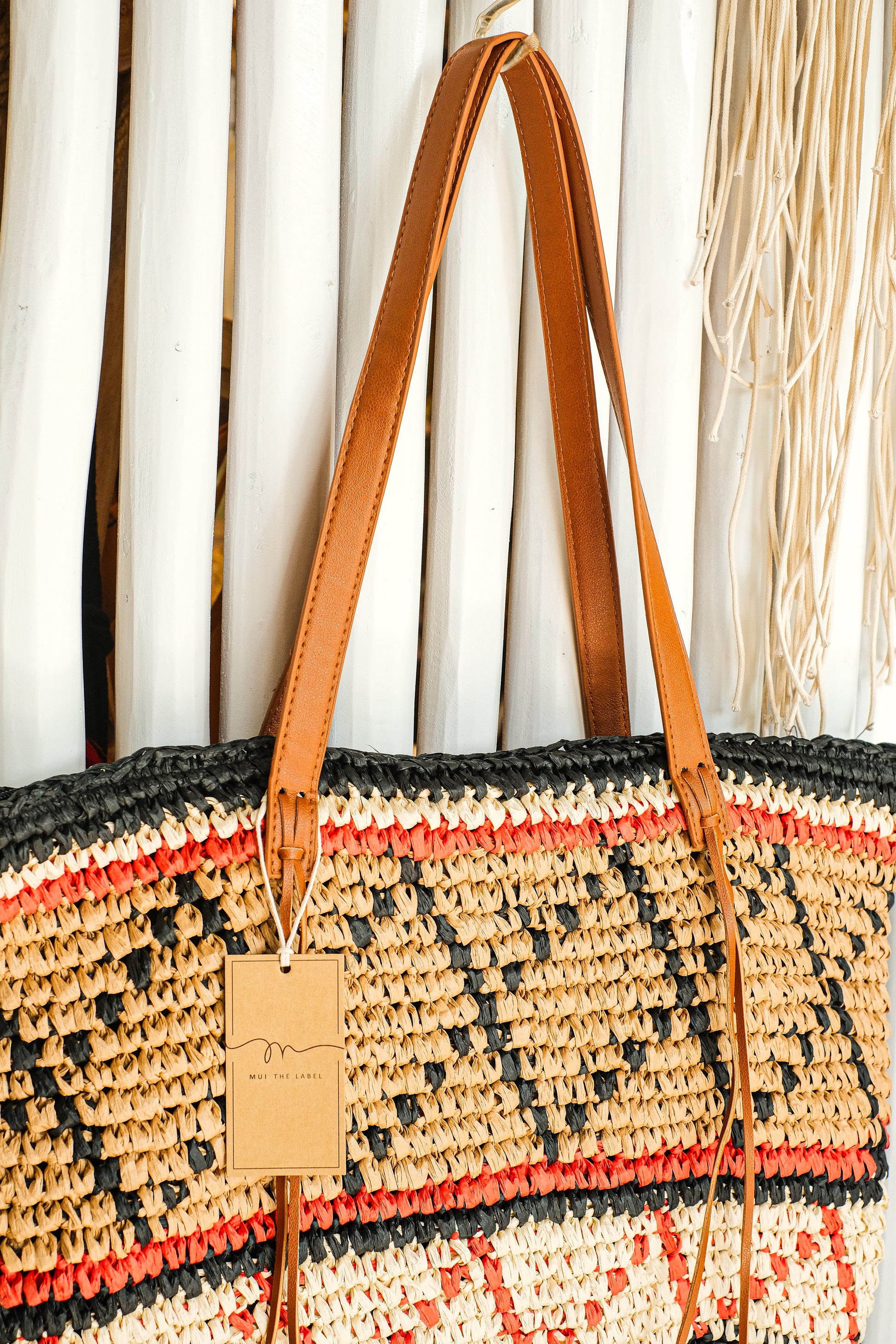 Brown, orange and black geometric pattern purse.