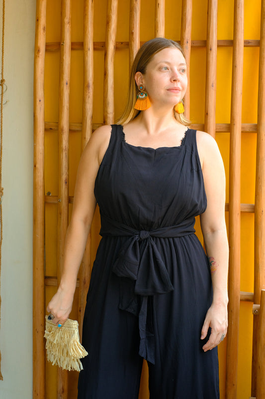 A black sleeveless jumpsuit. 