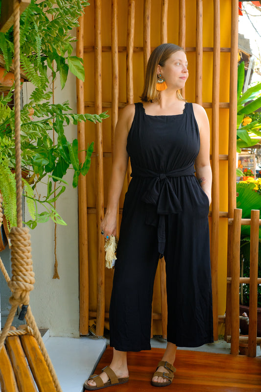 A black sleeveless jumpsuit.