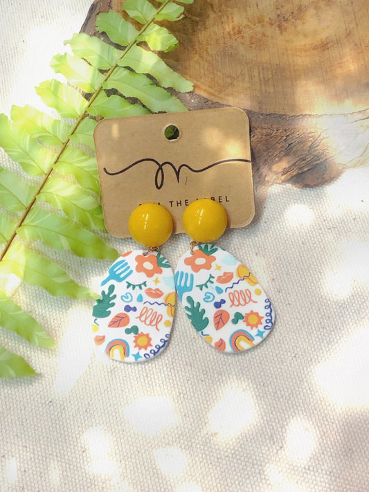 Earrings with colorful fun design and yellow detail. 