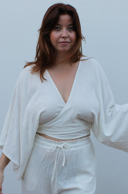 White boho style linen pants and top.