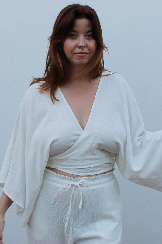 White boho style linen pants and top.