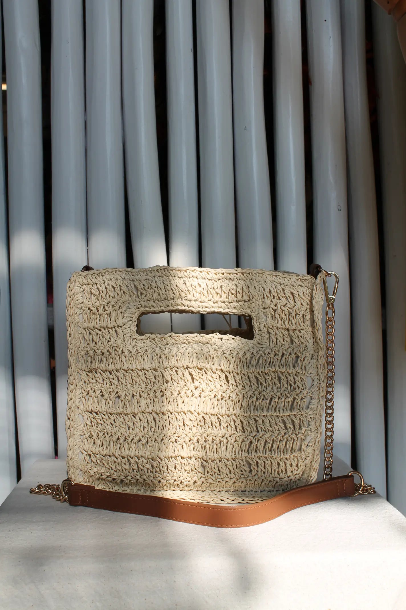 A light brown woven bag. 