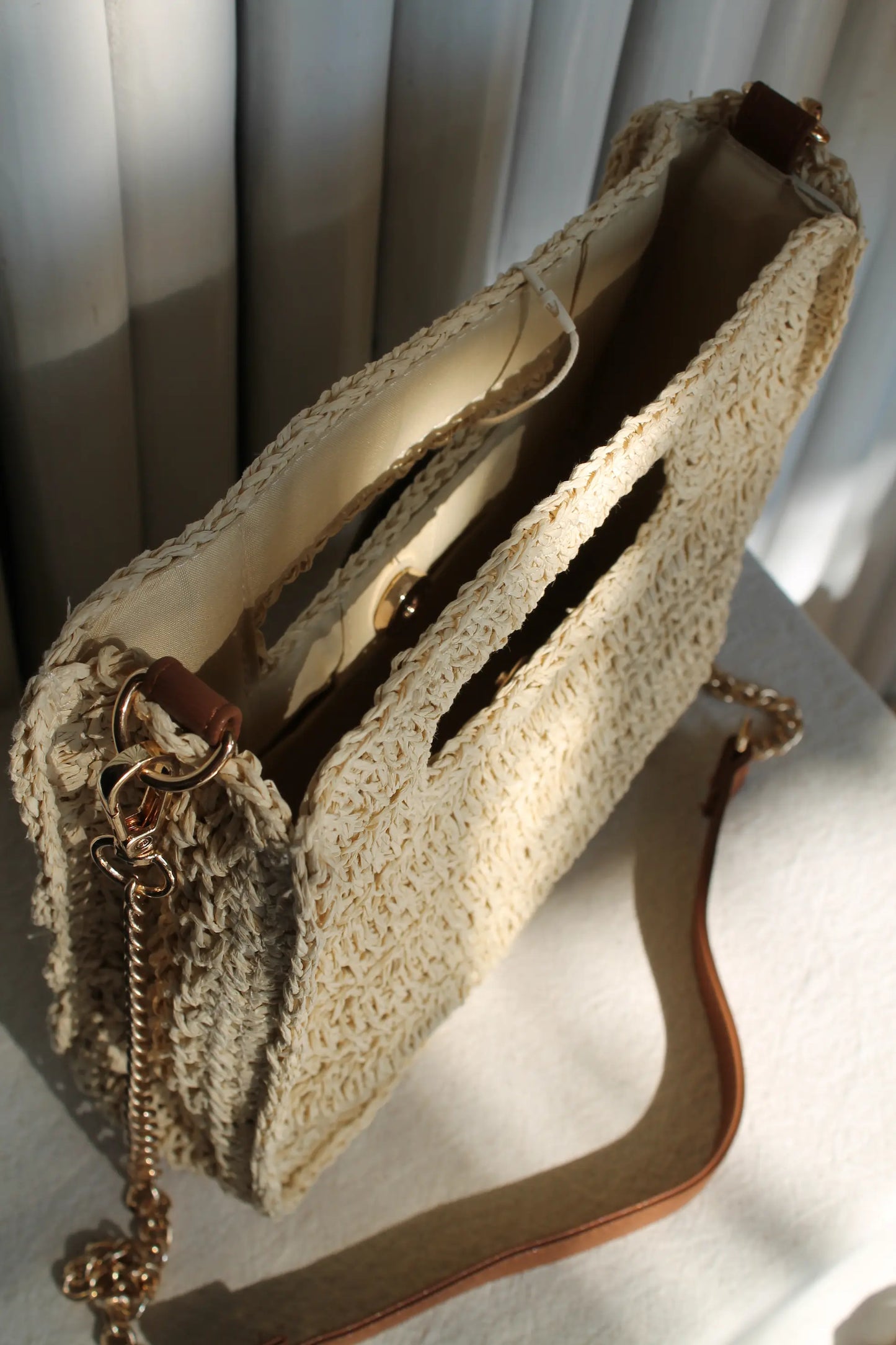 A light brown woven bag. 