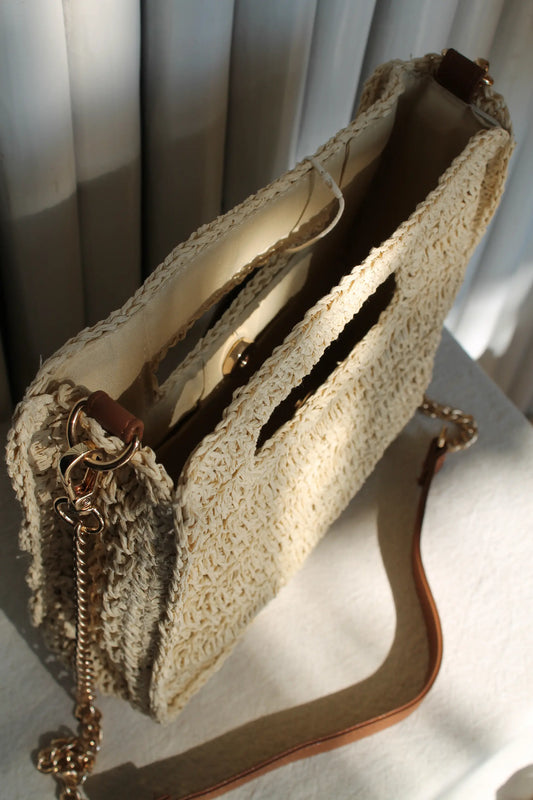 A light brown woven bag. 