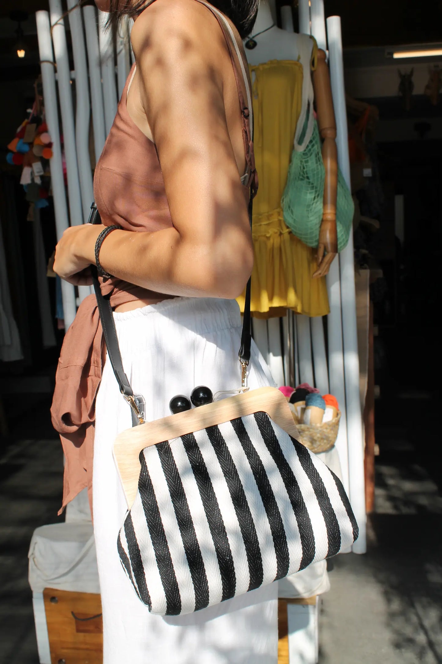 Purse with blue and white stripes. 