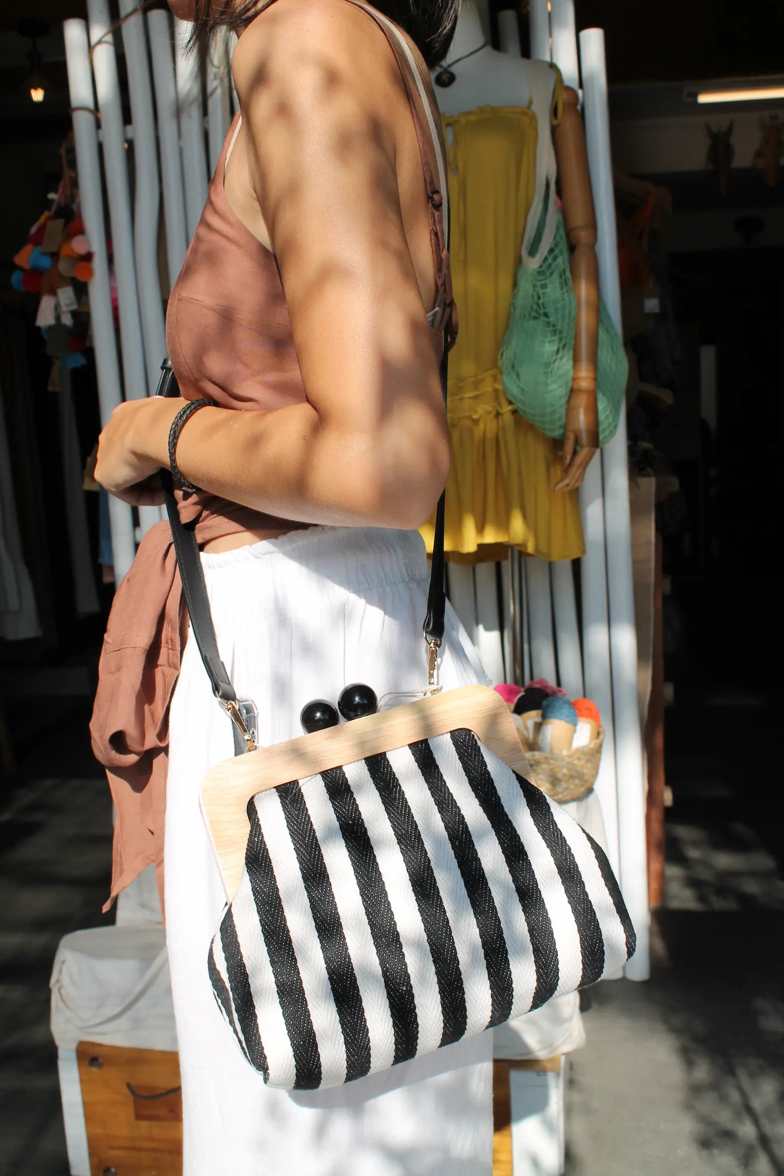 Purse with blue and white stripes. 