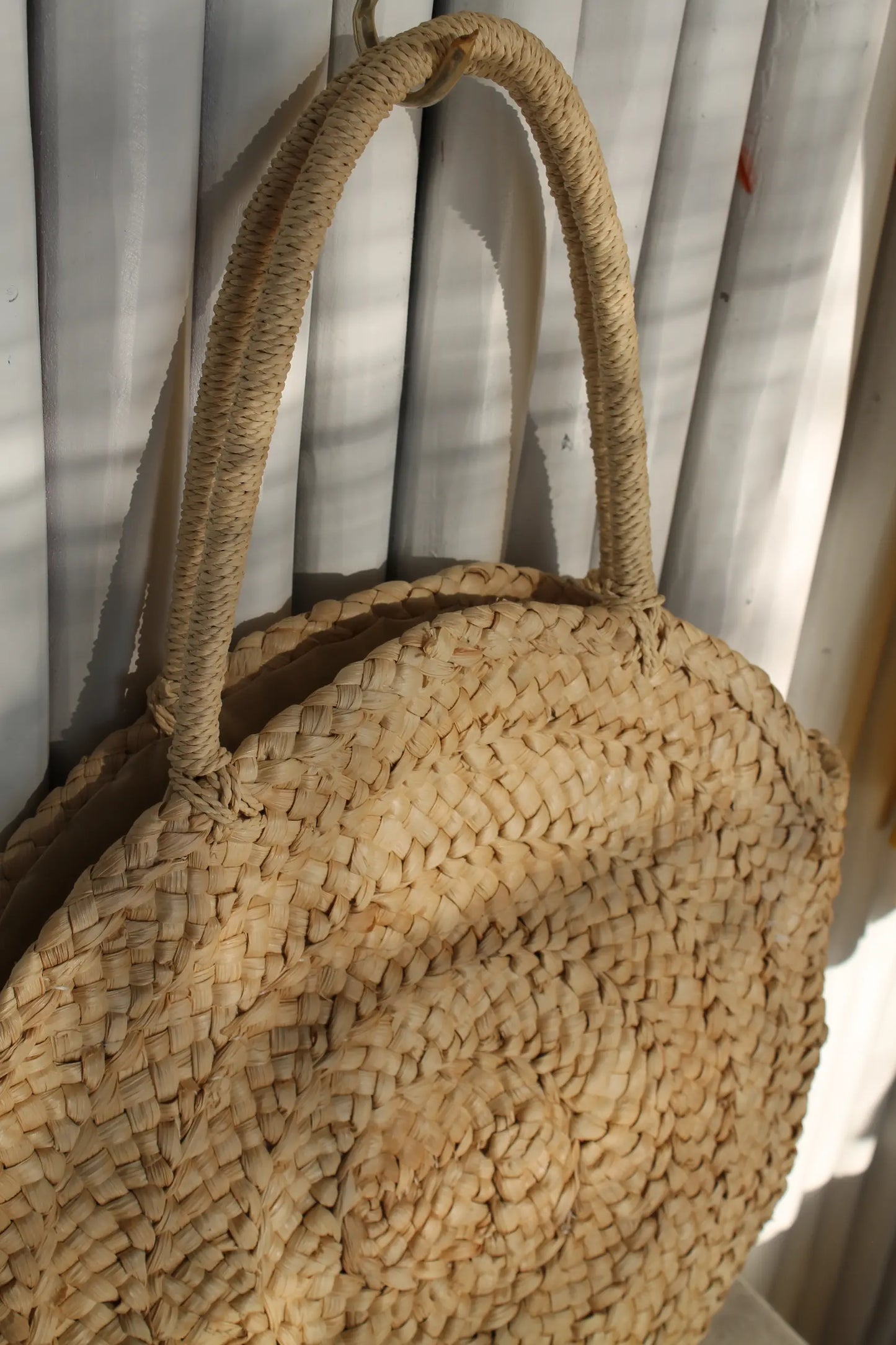 A round woven bag. 
