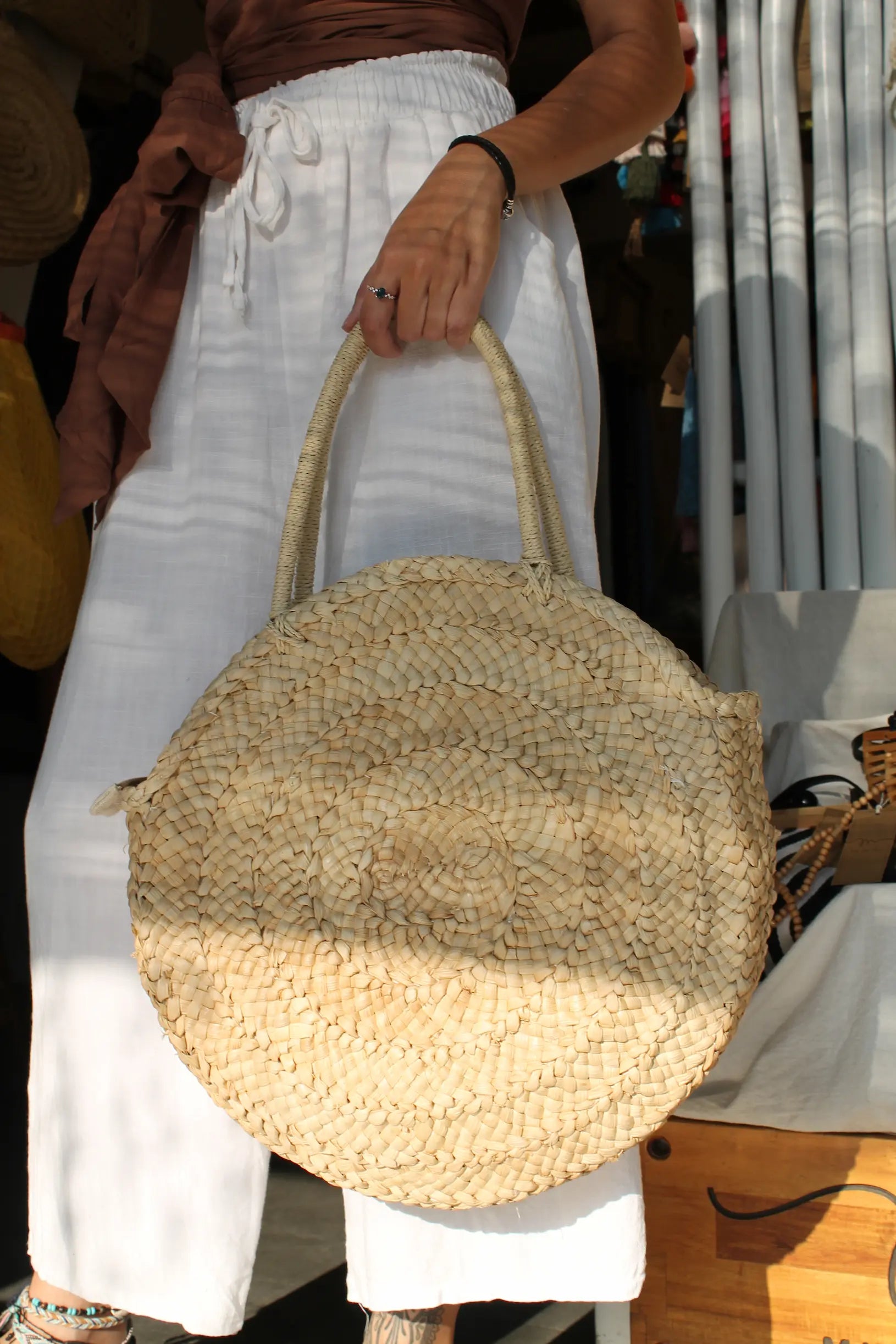 A round woven bag. 