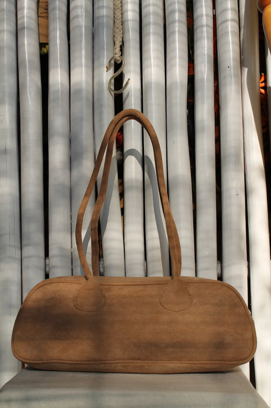 A brown faux suede bag. 