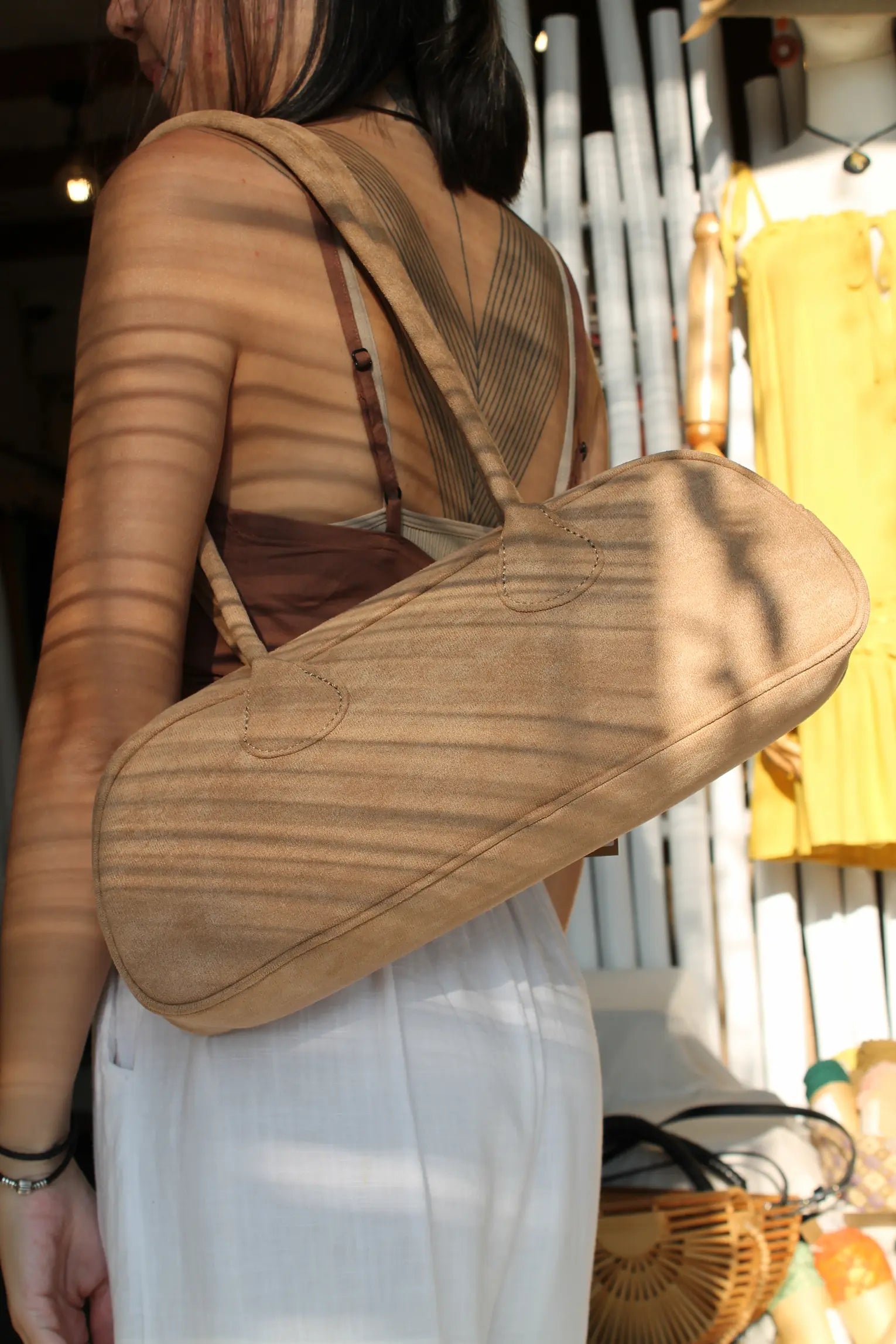 A brown faux suede bag. 