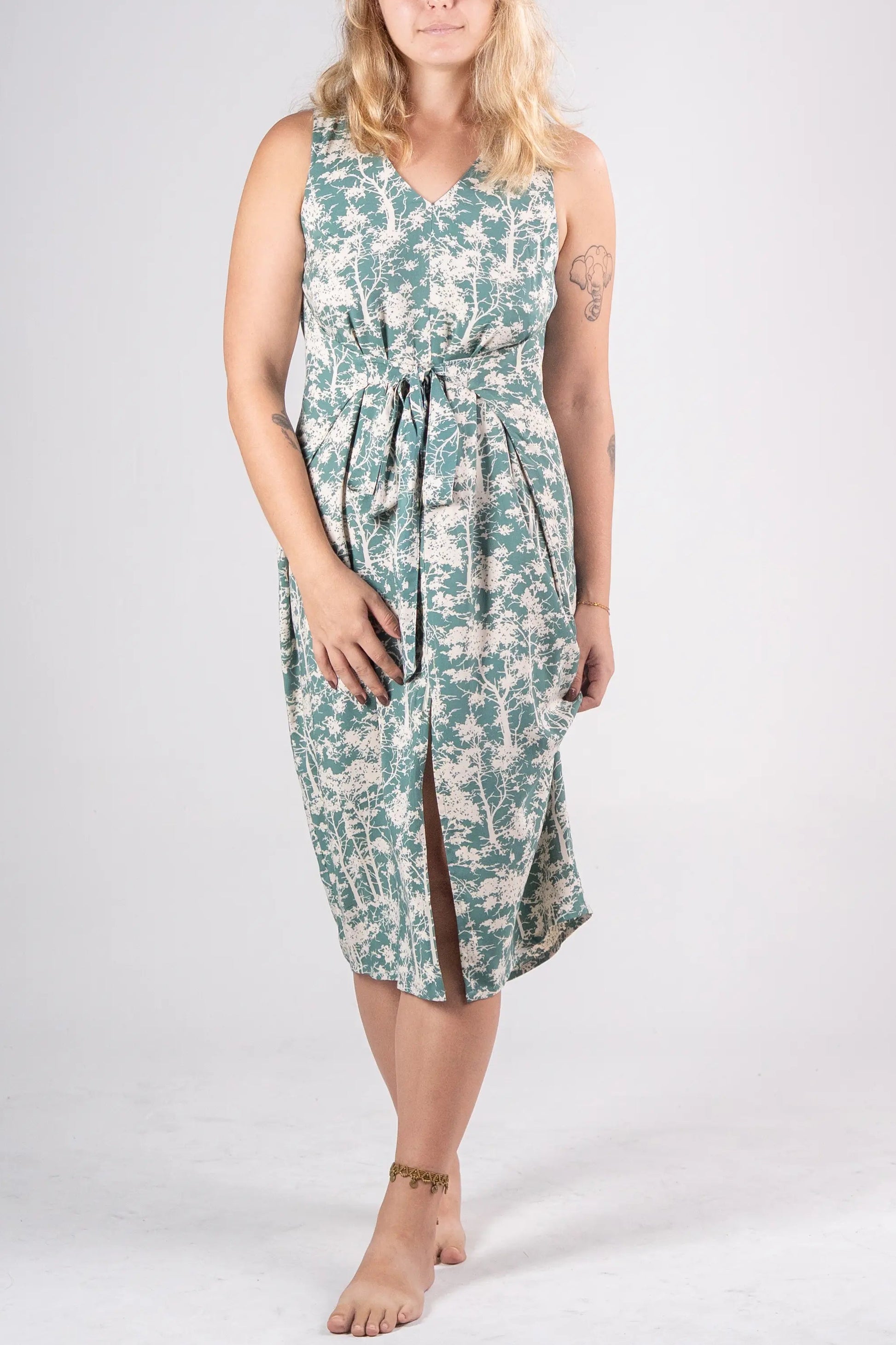 Woman wearing a floral dress on a white background