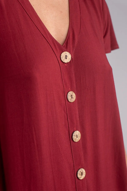 Red shirt with buttons on a plain background