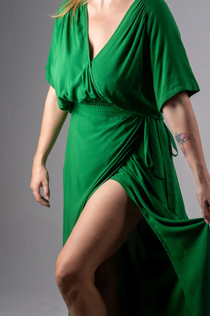 Green dress worn by a person on a gray background