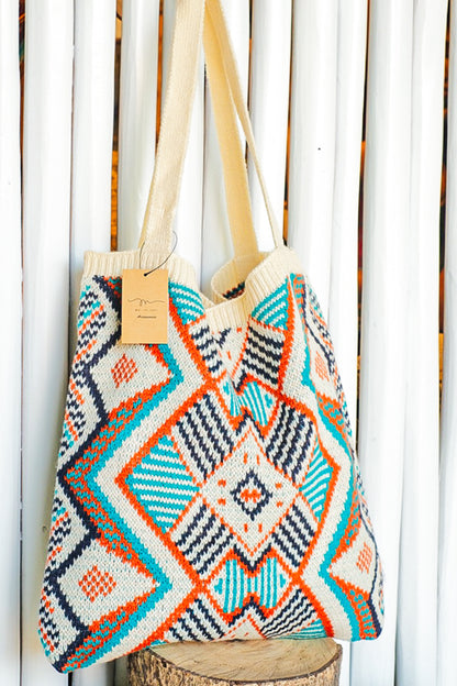 Orange, blue and cream colored geometric pattern purse.