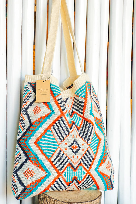 Orange, blue and cream colored geometric pattern purse.