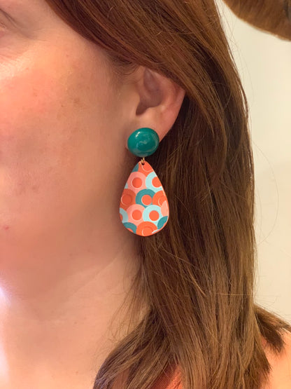 woman wearing boho style colorful circle pattern acrylic earrings