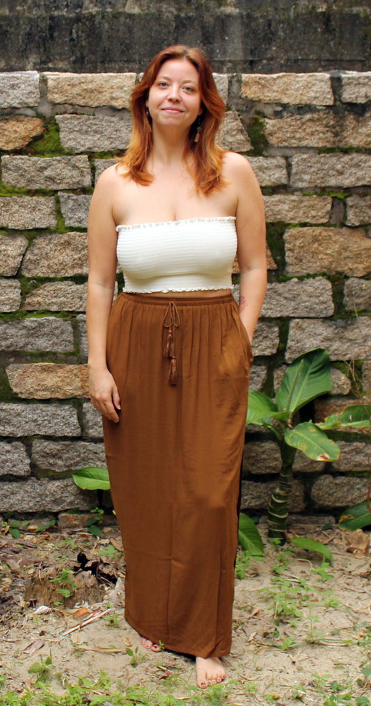 brown maxi skirt, white tube top of a vietnam clothing brand